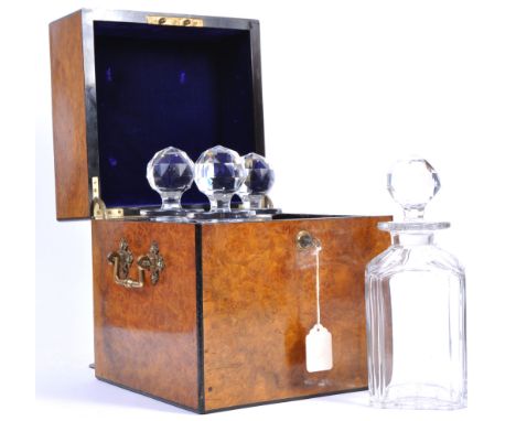 A stunning 19th Century Victorian burr walnut decanter box tantalus comprising four larger cut glass decanters housed within 