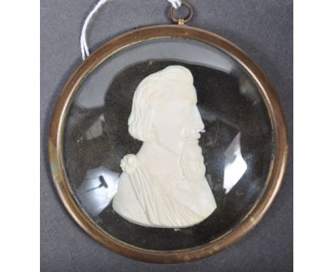 A 19th Century German antique hand carved ivory portrait miniature profile study of a Gentleman known as Count Ellex. Set to 