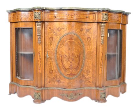 An impressive marble topped walnut and marquetry inlaid serpentine fronted pier cabinet / sideboard credenza. Raised on pad f