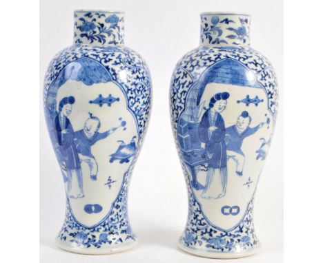 A pair of 18th Century Chinese Qing Dynasty antique porcelain blue and white vases of Meiping form. The china vases having ca