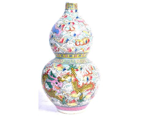 An early 20th Century Chinese antique porcelain double gourd vase having hand painted enamel decoration depicting dragons cha