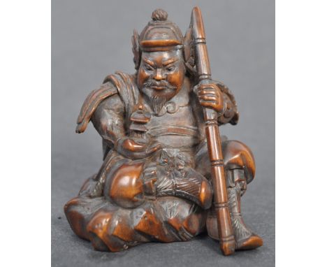 A fine Japanese believed Edo period / 19th century carved wooden signed netsuke. The netsuke in the form of a warrior, in typ