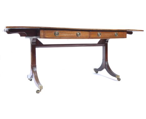 An early 19th Century Georgian English antique mahogany large library table / sofa table having twin drop flaps with pair of 