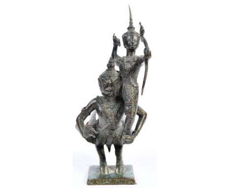 A 19th Century Chinese / Thai Thailand bronze figurine group depicting a Ramayana Temple Guardian Archer with bow &amp; arrow