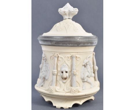 Sarreguemines - A 19th Century French antique two tone bisque porcelain tobacco pot / jar having detailed relief decoration d