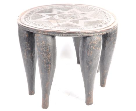 Tribal Antiquities - a late 19th century / early 20th century African tribal carved hardwood Nupe stool / table. The stool wi