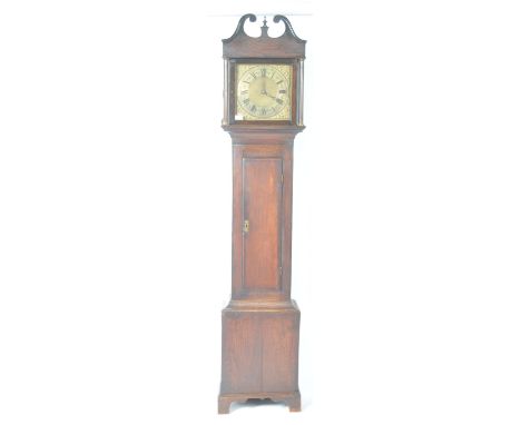 An early 18th Century Georgian English antique country house 30 hour longcase grandfather clock. The oak case housing a brass