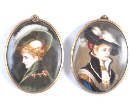 A beautiful pair of antique 19th century portrait paintings on porcelain - both depicting ladies in period dress. The paintin