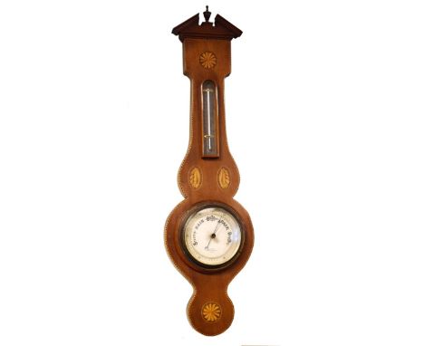 Inlaid mahogany cased aneroid barometer and thermometer having a silvered dial and scale   Condition: 