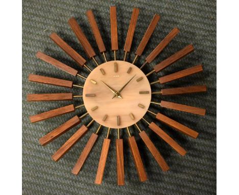 Modern Design - Manley sunburst style wall clock   Condition: 