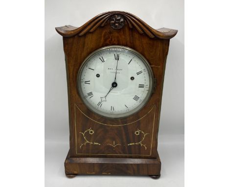 An interesting Regency mahogany bracket clock, the white 8 inch enamel dial signed 'John Grant London', the case having brass