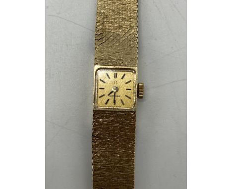 An Omega 1960/70s ladies 9ct gold manual wind wristwatch, the square gilt dial having baton markers and movement cal. 730, on