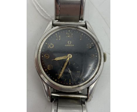 An Omega gents stainless steel manual wind wristwatch, circa 1950, having a black dial with Arabic numerals with subsidiary s