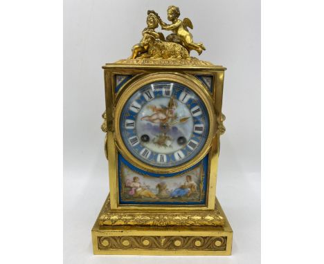 A late 19th century French gilt metal and porcelain mantle clock, the porcelain panels decorated with classical figures and f