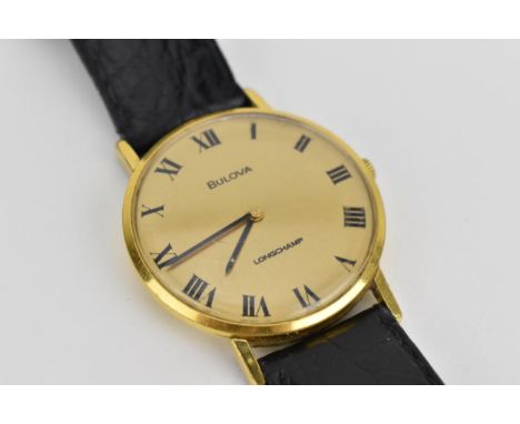 A gents Bulova Longchamp gold plated manual wind 17 jewel movement wristwatch having Roman numerals and black hands, on a lat