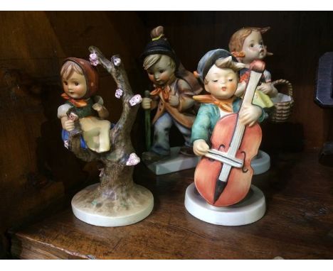 Four Hummel figures