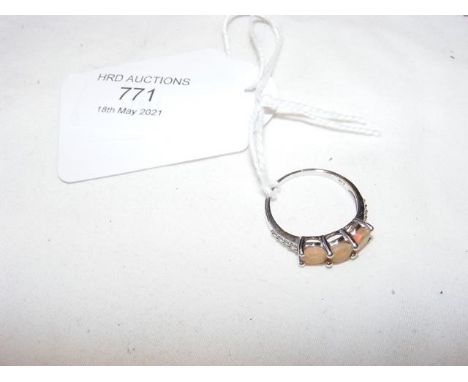 A ladies three stone ring in 18ct white gold setting