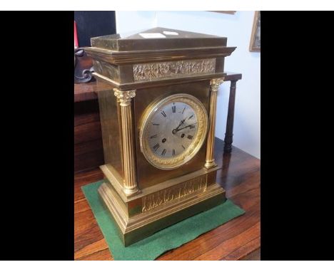 A 38cm high brass mantel clock with striking movement CONDITION REPORTLot offered not working.