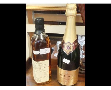 A Bollinger 1983 bottle of champagne together with a bottle of Michael Couvreur malt scotch whiskeyCONDITION REPORT.