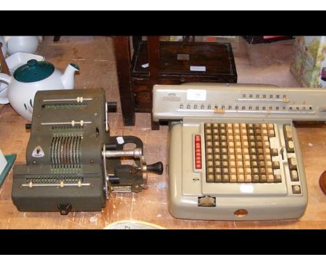 A Lagomarsino Numeria electro mechanical calculator, a Brunsviga mechanical calculator and a portable microscope in box 
