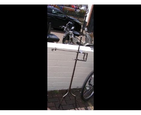 A wrought iron candlestick holder/stand