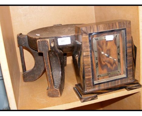 An Art Deco mantel clock, together with a carved wooden plant stand CONDITION REPORTfurther images as requested