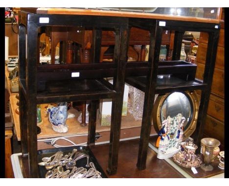 A pair of Oriental style two tier side tables and a candle trough