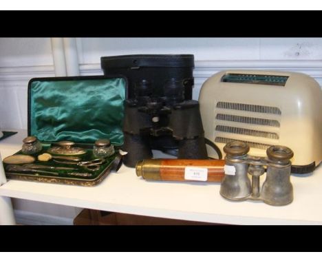 A vintage KB Bakelite radio, two pairs of binoculars, a telescope and a silver vanity set 