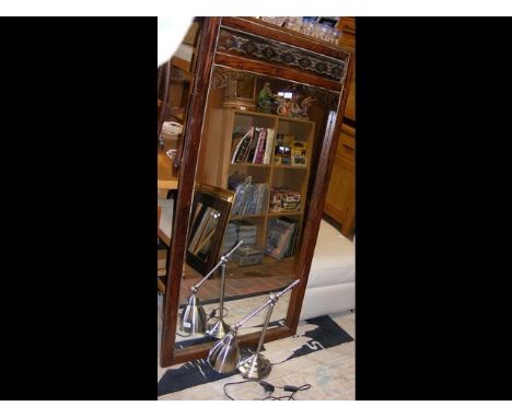 A wooden framed mirror, formerly from a wardrobe, now to hang on a wall, together with a modern stainless steel lamp 