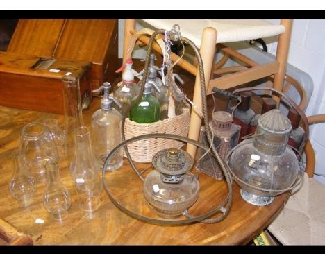 A collection of glass siphons and glass oil lamp covers, etc. CONDITION REPORTWe have attached a number of additional images 