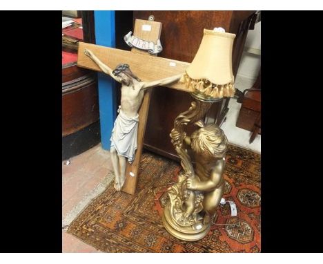 A gilt cherub table lamp together with plaster figure of Christ on cross