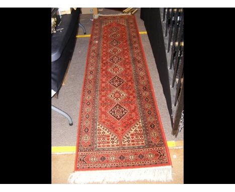 A Middle Eastern style runner with geometric border