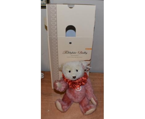 Modern Steiff Teddy Bear Dolly, in dusty pink and white, with red ruffle to the neck, boxed with certificate.  With some crea