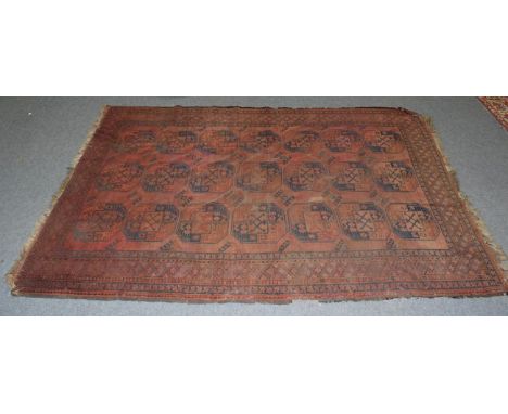 An Ersari carpet, the madder field of elephant foot guls enclosed by stepped diamond medallion borders, 316cm by 226cm 