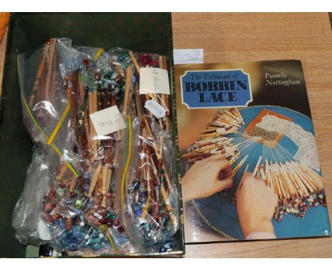A collection of over 120 mainly wooden modern bobbins, all with coloured glass spangles, lace pins, one volume The Technique 