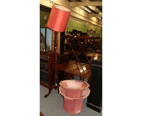 A mahogany standard lamp with a tripod base and shade; together with two additional shades; and a butlers tray on stand 