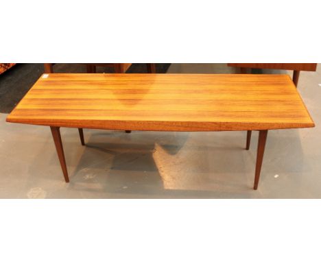 Gordon Russell Rosewood coffee table  L: 122cm  W: 46cm  H: 40cm CONDITION REPORT: No damage.  Top may have been refinished, 