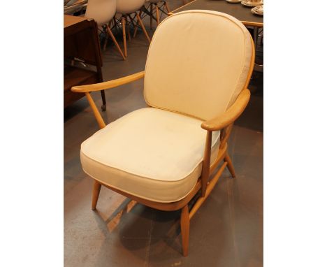 Pair of Ercol easy chairs in light elm