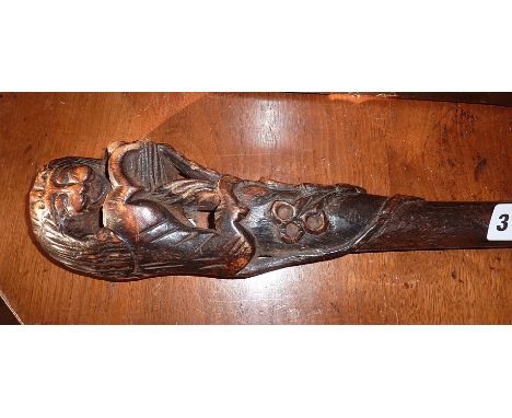 Old Oriental carved wood walking stick with grip in the form of a lion