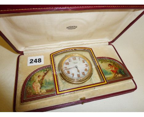 Fine painted enamel dressing table clock with mother of pearl dial. By Brooking of Madrid in good working order and with fitt