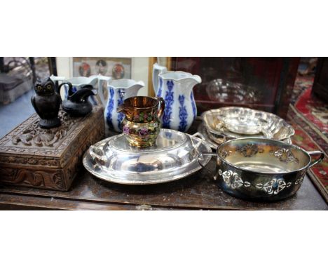 A GRADUATED SET OF THREE VICTORIAN JUGS together with a Poole Pottery vase, an early 20th century Bakelite ink well in the fo