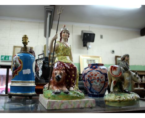 A LARGE STAFFORDSHIRE TYPE POTTERY FIGURE of Britannia 36cm high together with a Continental porcelain table lamp decorated w