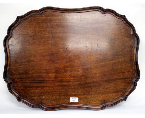 A 19TH CENTURY MAHOGANY CHIPPENDALE STYLE TRAY with shaped piecrust edge, 62cm x 47cm 