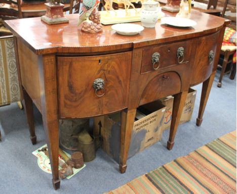 A GEORGIAN MAHGANY BOW FRONTED SIDE BOARD, the top with cross banded and strung decoration, over a central short drawer and f