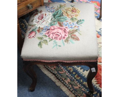 A VICTORIAN SIMULATED ROSEWOOD STOOL with overstuffed upholstered needlework seat and carved cabriole legs, approximately 44c