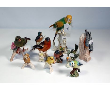 A collection of ten ceramic birds, including a Goebel Bullfinch, Greenfinch, Beswick Blue Tit, etc