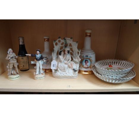 A mixed lot, to include two commemorative Bells Whisky decanters and contents, Staffordshire arbour gorup, bisque figure 'A G