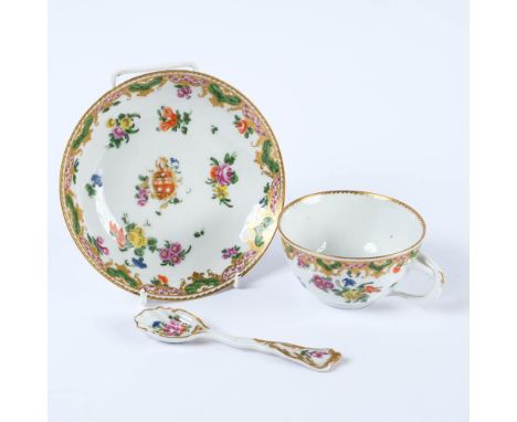 A Bristol Armorial porcelain tea cup and saucer from the Ludlow of Campden service and a spoon from the same service, circa 1
