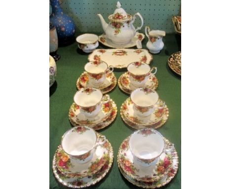 An Old Country Roses six piece tea service, comprising: teapot, sugar bowl, milk jug, cake plates and six trios.