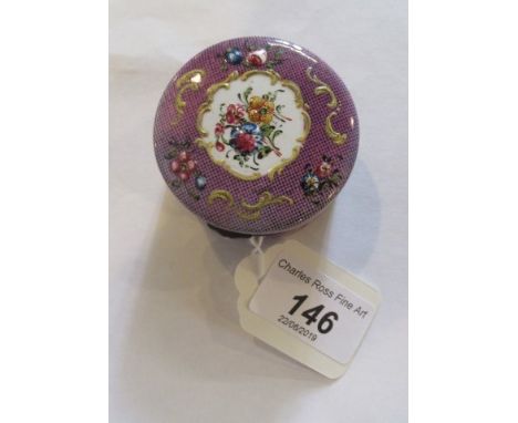 A late 18th century South Staffordshire (Bilston) circular enamel cashew box, painted with cut flowers on a puce ground, toge